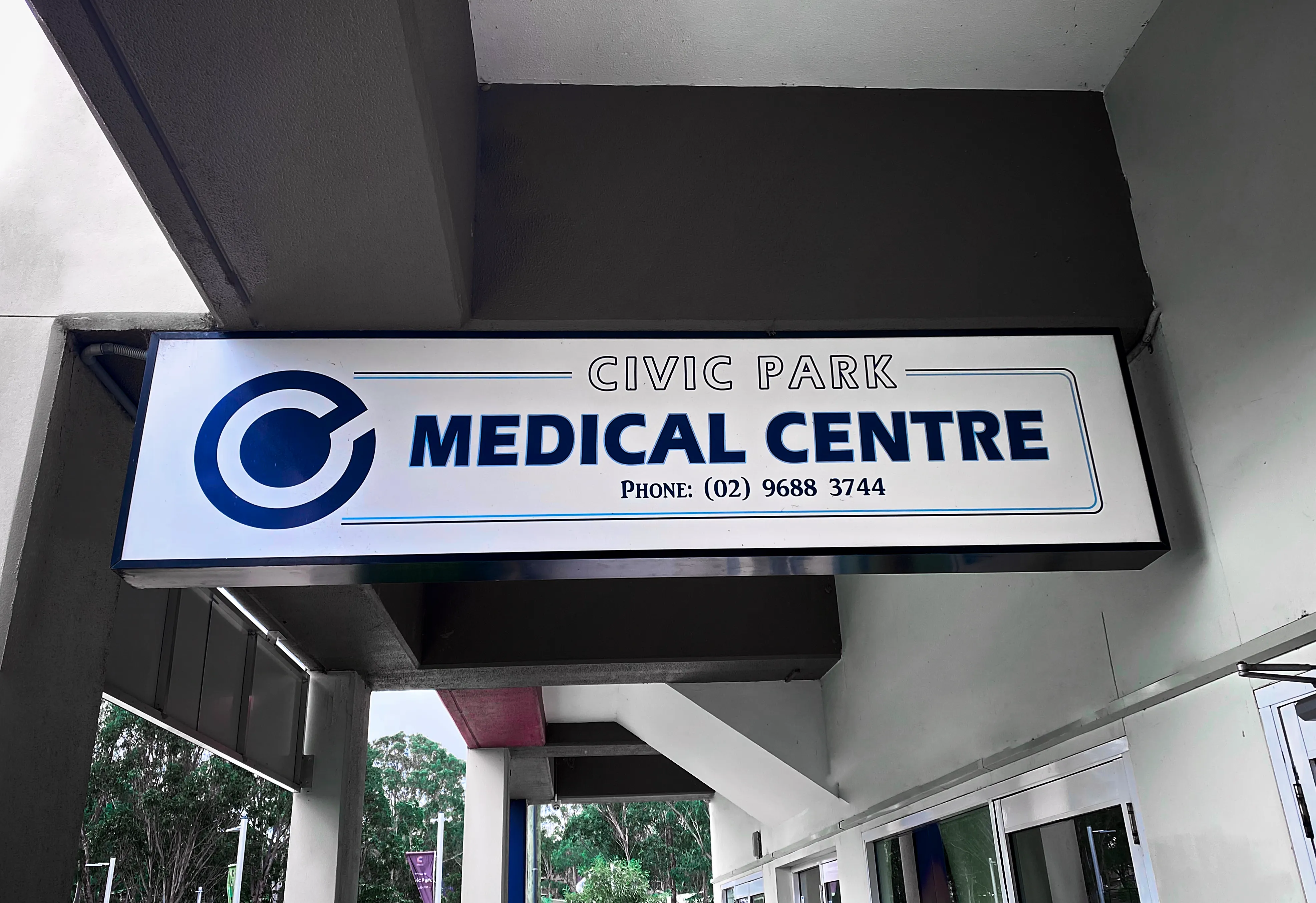 Civic Park Medical Centre female patient meditating while sitting in nature.